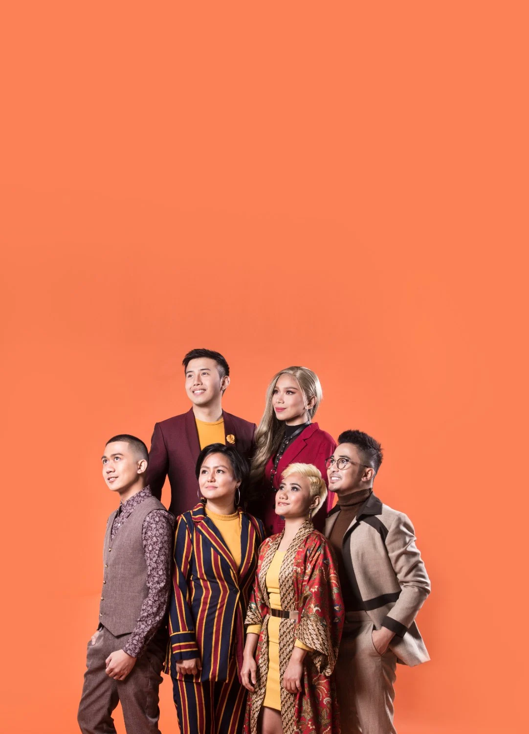 Pinopela studio portrait on an orange backdrop